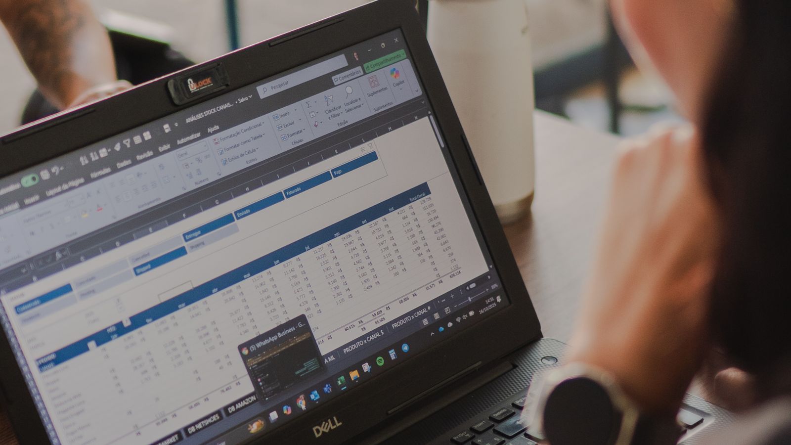 A person analyzing performance data on a laptop screen